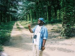 Adam Johnson studying the land in Ghana