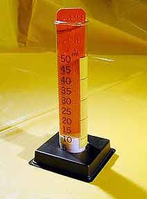 A tube-shaped instrument marked in Braille and used to measure rainfall amount