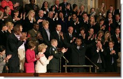 Wesley Autrey receives a standing ovation as President Bush recognizes him during his State of the Union Address at the U.S. Capitol Tuesday evening, Jan. 23, 2007. "Three weeks ago, Wesley Autrey was waiting at a Harlem subway station with his two little girls, when he saw a man fall into the path of a train," said President Bush. "With seconds to act, Wesley jumped onto the tracks, pulled the man into the space between the rails, and held him as the train passed right above their heads. He insists he's not a hero. He says: 'We got guys and girls overseas dying for us to have our freedoms. We have got to show each other some love.' There is something wonderful about a country that produces a brave and humble man like Wesley Autrey." White House photo by Shealah Craighead