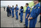 President George W. Bush greets the Space Shuttle Discovery astronauts outside Air Force One, Thursday, Nov. 8, 2007, on the tarmac at Ellington Field in Houston, Texas. President Bush congratulated Space Shuttle Commander Pamela Melroy, left, and fellow astronauts, from left, Pilot George Zamka and mission specialists Scott Parazynski, Stephanie Wilson, Douglas Wheelock, Paolo Nespoli and Clayton Anderson, not seen in photo, on their successful 15-day mission to the International Space Station. White House photo by Eric Draper