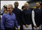 President George W. Bush spends a moment with U.S. Olympic Men's Basketball Team members, from left, Kobe Bryant, Jason Kidd and Deron Williams Sunday, Aug. 10, 2008, during a visit with the team prior to their game against China at the 2008 Summer Olympic Games in Beijing. White House photo by Eric Draper