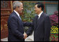 President George W. Bush shakes hands with China's President Hu Jintao following his visit and meeting Sunday, Aug. 10, 2008, with the Chinese leader at Zhongnanhai, the Chinese leaders compound in Beijing. White House photo by Eric Draper