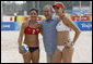 President George W. Bush stands with the U.S. Women's Beach Volleyball team of Misty May-Treanor, left, and Kerri Walsh at the Chaoyang Park practice courts Saturday, Aug. 9, 2008, before their matches at the 2008 Summer Olympics in Beijing. "What an honor," Walsh said. "He's just a great sports fan and he exudes optimism and pride in his country. I know he's proud of us." White House photo by Eric Draper