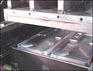 Top and bottom forming dye press components.