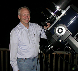 Ralph Pass standing next to his telescope