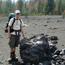 Hiker posing next to lava bomb