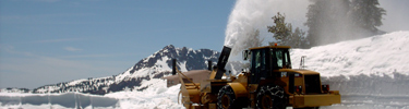 snowplow moving snow at Bumpass Hell parking area