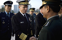 Chairman of the Joint Chiefs of Staff U.S. Navy Adm. Michael G. Mullen greets Korean service members after a full honors ceremony with Korean Chairman of the Joint Chiefs of Staff Gen. Kim Kwan-Jin, Seoul, Republic of Korea, Nov. 6, 2007. Defense Dept. photo by U.S. Navy Petty Officer 1st Class Chad McNeeley