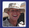 Marine Corps Lance Cpl. Trevor G. Thuman, 22  smiles after receiving chevrons during a promotion ceremony at Camp Blue Diamond, Iraq, May 5.  U.S. Marine Corps photo by Cpl. Veronika Tuskowski