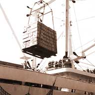photo of cargo ship being loaded