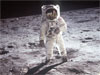 Astronaut Edwin E. Aldrin, Jr., lunar module pilot, walks on the surface of the Moon.