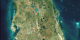 Viewing Earth from space, the Landsat 7 satellite takes images of
the Earth, which allows us to look at land changes such as; urban growth, deforestation,
and overall changes in the Earth itself. Here is a Landsat 7 image of Tampa, Florida.