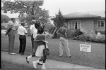 [Group of African Americans viewing the bomb-damaged home of Arthur Shores, NAACP attorney, Birmingham, Alabama]
