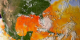 Sea surface temperature with clouds overlaid showing the first half of the 2005 hurricane season  (no storm tracks)