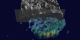 Peel away the clouds to reveal the underlying rain structure.  The rain structure is depicted with 5 different isosurfaces.  The first isosurface is grey and depicts areas with 0.5 inches of rain per hour.  The second is light blue and reflects 1.0 inches of rain per hour.  The third is green and shows 1.7 inches of rain per hour.  The forth is yellow and represents 2.0 inches of rain per hour. The last isosurface is red and shows 2.2 inches or more of rain per hour.