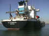 A cargo vessel anchored in the harbor.