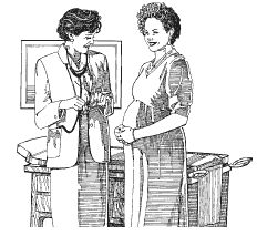 Image of a pregnant woman speaking with a health care professional.