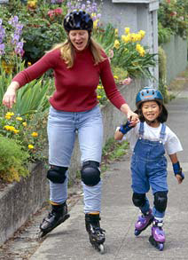 Mom and daughter rollerblading