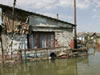 Residents negotiate waters in a flooded village near the Danube