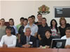 Judge Ken Stuart, Director of the USAID JSI (seated, center), joins Targovishte judges and students following a mock trial at the JSI Regional Grantee Exhibition