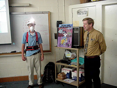 David Dykes, MSHA special investigator, gives students an opportunity to test oxygen and noise levels and try on a miner’s belt.