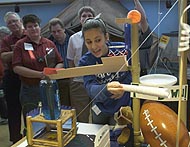 A team runs its machine at Argonne's Rube Goldberg machine contest.
