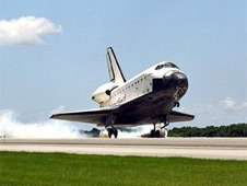 Space shuttle landing at Kennedy Space Center.