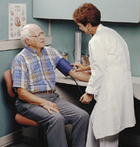 Photo of a physician checking a patient's blood pressure. - Click to enlarge in new window.