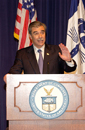 Secretary Carlos Gutierrez at podium