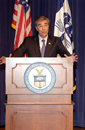 Secretary Carlos Gutierrez at podium