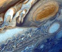 The planet Jupiter's Great Red Spot is a huge mass of swirling gas. At its widest, it is about three times the diameter of the Earth.
