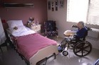 Photo of woman in wheel chair. - Click to enlarge in new window.