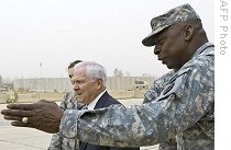 US Secretary of Defense Robert Gates arrives at Baghdad International Airport, where he is greeted by the Deputy US Commander in Iraq, General Lloyd Austin, 15 Sept. 2008