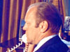 President Gerald Ford talks to the crew of the Apollo Soyuz Test Project as the mission orbited the Earth on July 18, 1975.