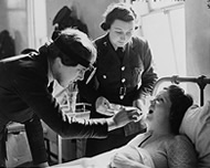 Woman doctor examining a patient.
