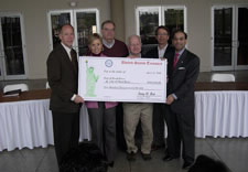 Photo of officials holding an EDA investment check.  Pictured L-R:  U.S. Representative Greg Walden; Hood River Mayor Linda Streich; Hood River City Manager Bob Francis; Port Commission President Fred Duckwall; Port Executive Director Michael McElwee; and U.S. Assistant Secretary of Commerce for Economic Development Sandy K. Baruah. Click here for larger image.