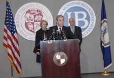 Secretary Gutierrez at podium accompanied by Secretary Spellings (left) and Secretary Chertoff (right).  Click here for larger image.