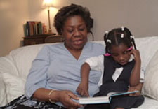 Photo of mother reading to child. Click here for larger image.