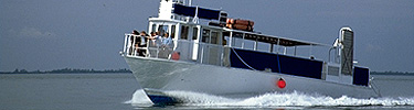 The Reef Rover motors over a glassy Biscayne Bay.