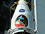 The Mars Reconnaissance Orbiter, inside its protective fairing, is raised to the top of the Atlas V rocket.
