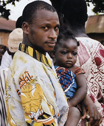 Photo of a man and his daughter who attended a community family planning meeting