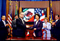 Secretary Chao (third from right) and Mexican Foreign Secretary Luis Ernesto Derbez (third from left) sign a joint declaration on July 21 in Washington, D.C. Mexican Undersecretary for Foreign Affairs Geronimo Gutierrez (second from left) and Mexican Ambassador to the United States Carlos de Icaza (far left), Assistant Secretary of Labor for Employment Standards Victoria A. Lipnic (second from right), and Assistant Secretary of Labor for Occupational Safety and Health John Henshaw (far right) look on.