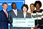 Secretary Chao (center) presents a $10 million grant to Fred Davie (2nd from left) of Public/Private Ventures (P/PV) to help ex-offenders make a successful transition to community life and long-term employment. With Secretary Chao are Ke