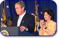 President Bush Announcing a Back to Work Relief Package with Secretary Chao at the Department of Labor on October 4, 2001.