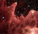 Spitzer Captures Cosmic Mountains Of Creation