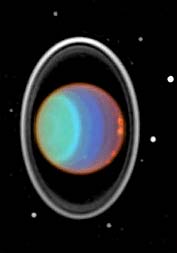 This false-color image taken by the Hubble Space Telescope using infrared light shows Uranus's rings and clouds. The different colors in the image represent different atmospheric conditions.