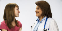 A teen girl consulting with her healthcare professional