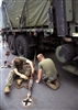 U.S. Marines chain down a tactical water purification system aboard USS Harpers Ferry, May 12, 2008, to prepare to provide humanitarian assistance to Burmese victims of Cyclone Nargis. The system can provide approximately 900 to 1,500 gallons of potable water per hour. 