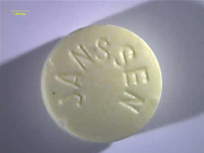 Front photo of yellow Haloperidol with “Janssen” imprinted on the tablet