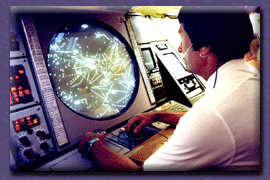 Worker in front of circular screen